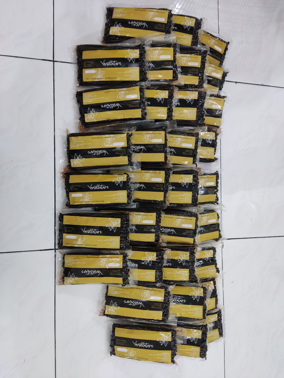 Vanillature wholesale vanilla export cartons stacked for shipment